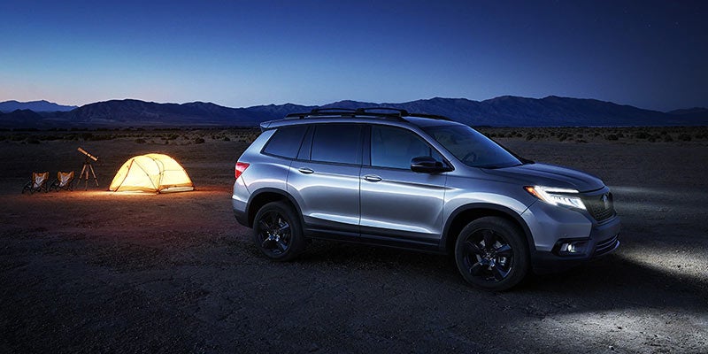 2021 Honda Passport outside with camping gear behind it